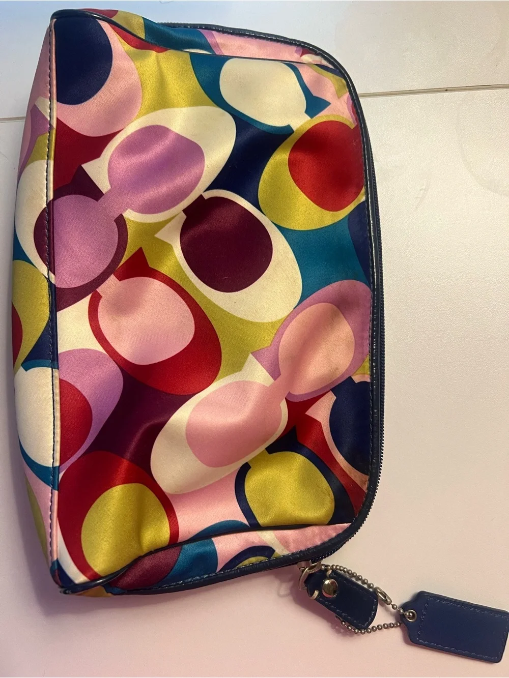COACH multi color op art print satin cosmetic pouch.